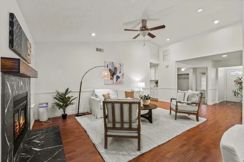 a living room with furniture and a fireplace