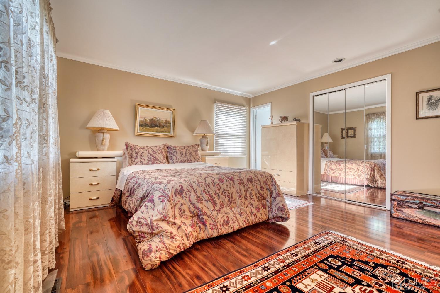 19 Morningside Drive Old Bridge, NJ 08857 - Photo 14 of 40 a bedroom with a bed and a view of living room