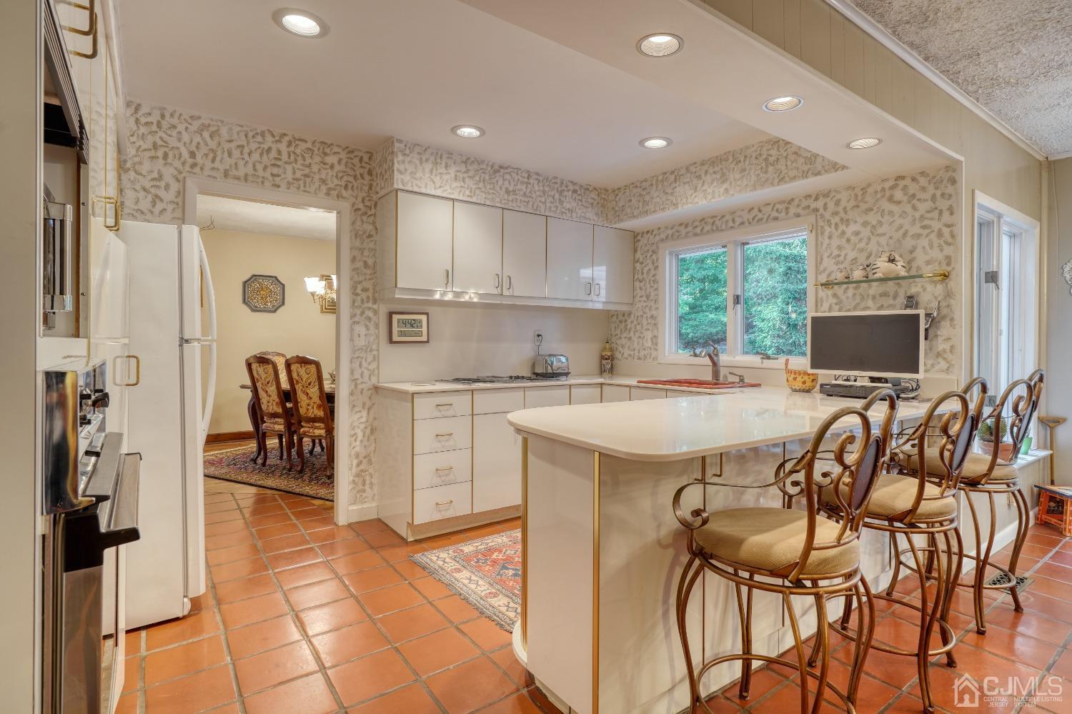 19 Morningside Drive Old Bridge, NJ 08857 - Photo 18 of 40 a kitchen with stainless steel appliances kitchen island granite countertop a refrigerator and cabinets