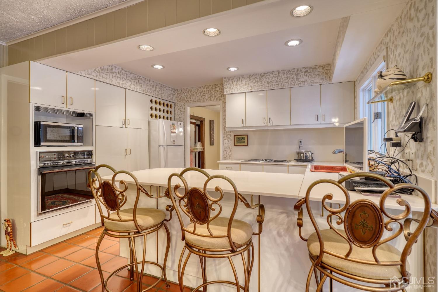 19 Morningside Drive Old Bridge, NJ 08857 - Photo 19 of 40 a view of a dining room with furniture a kitchen and chandelier