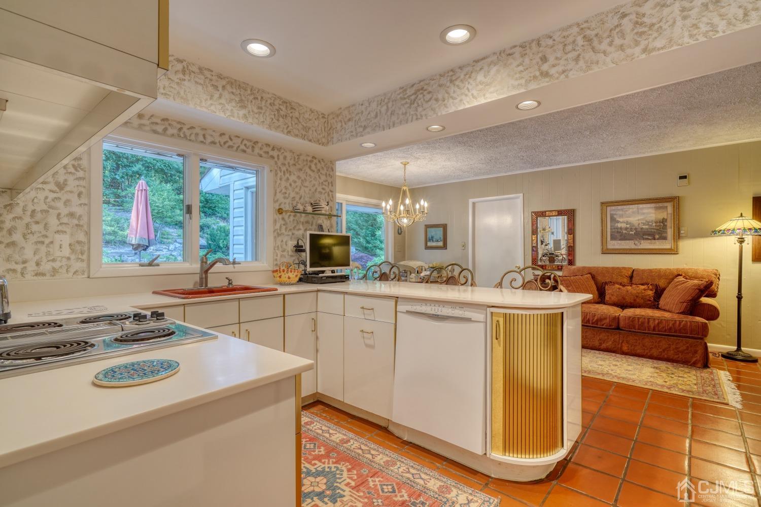 19 Morningside Drive Old Bridge, NJ 08857 - Photo 20 of 40 a kitchen that has a sink a stove top oven a counter space and living room view