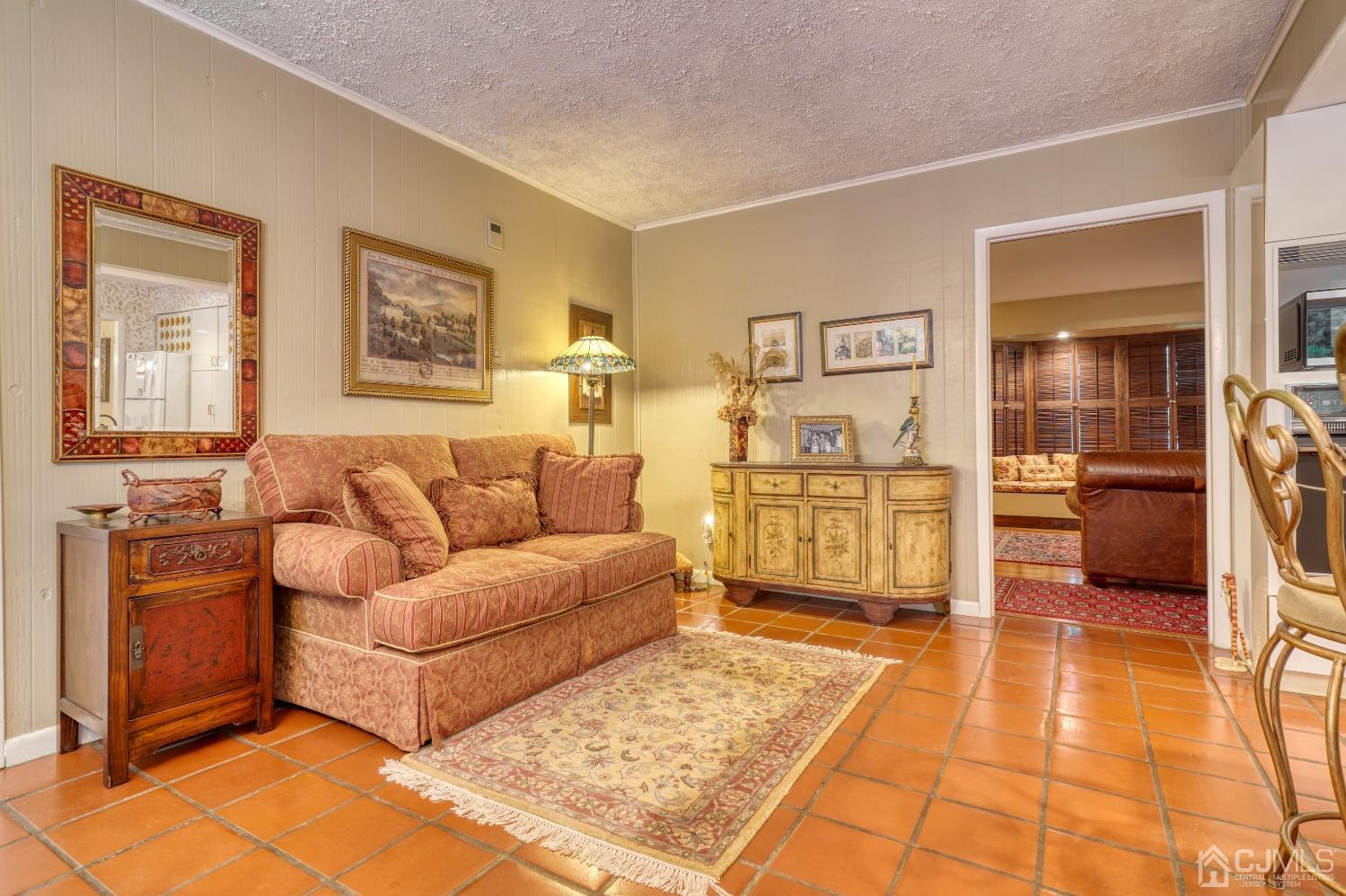 19 Morningside Drive Old Bridge, NJ 08857 - Photo 21 of 40 a living room with a couch and a dresser with wooden floor