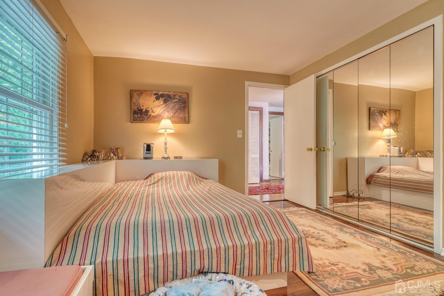 19 Morningside Drive Old Bridge, NJ 08857 - Photo 25 of 40 a bedroom with a bed and a large mirror