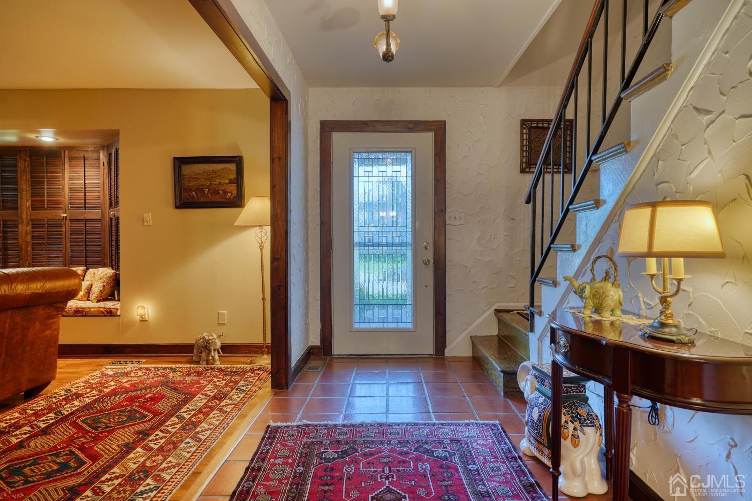 19 Morningside Drive Old Bridge, NJ 08857 - Photo 4 of 40 a view of a hallway with wooden floor and a living room