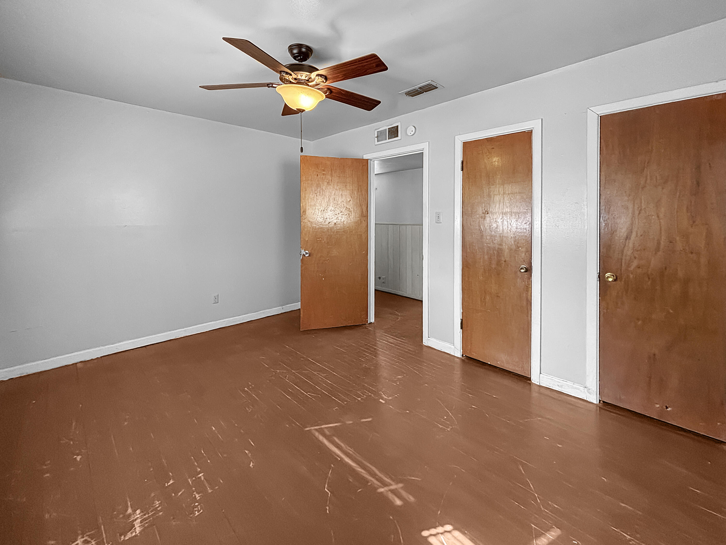 4411 45th Street Lubbock, TX 79414 - Photo 31 of 44 an empty room with closet and a chandelier fan