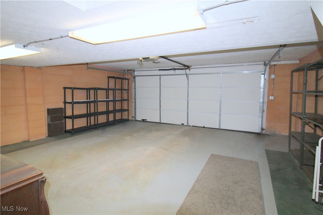 6476 State Road Cleveland, OH 44134 - Photo 24 of 26 Attached Oversized Two Car Garage with Plenty of Storage Space, Newer Garage Door and Opener. Shelving Stays
