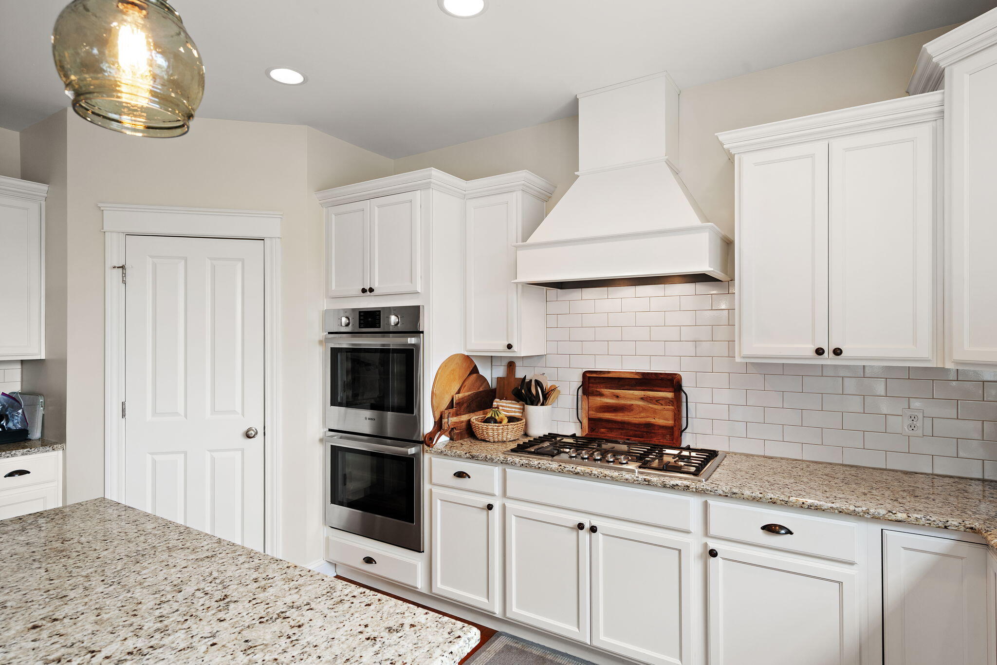 1684 Kleven Lane Crown Point, IN 46307 - Photo 14 of 55 a kitchen with granite countertop a stove and white cabinets