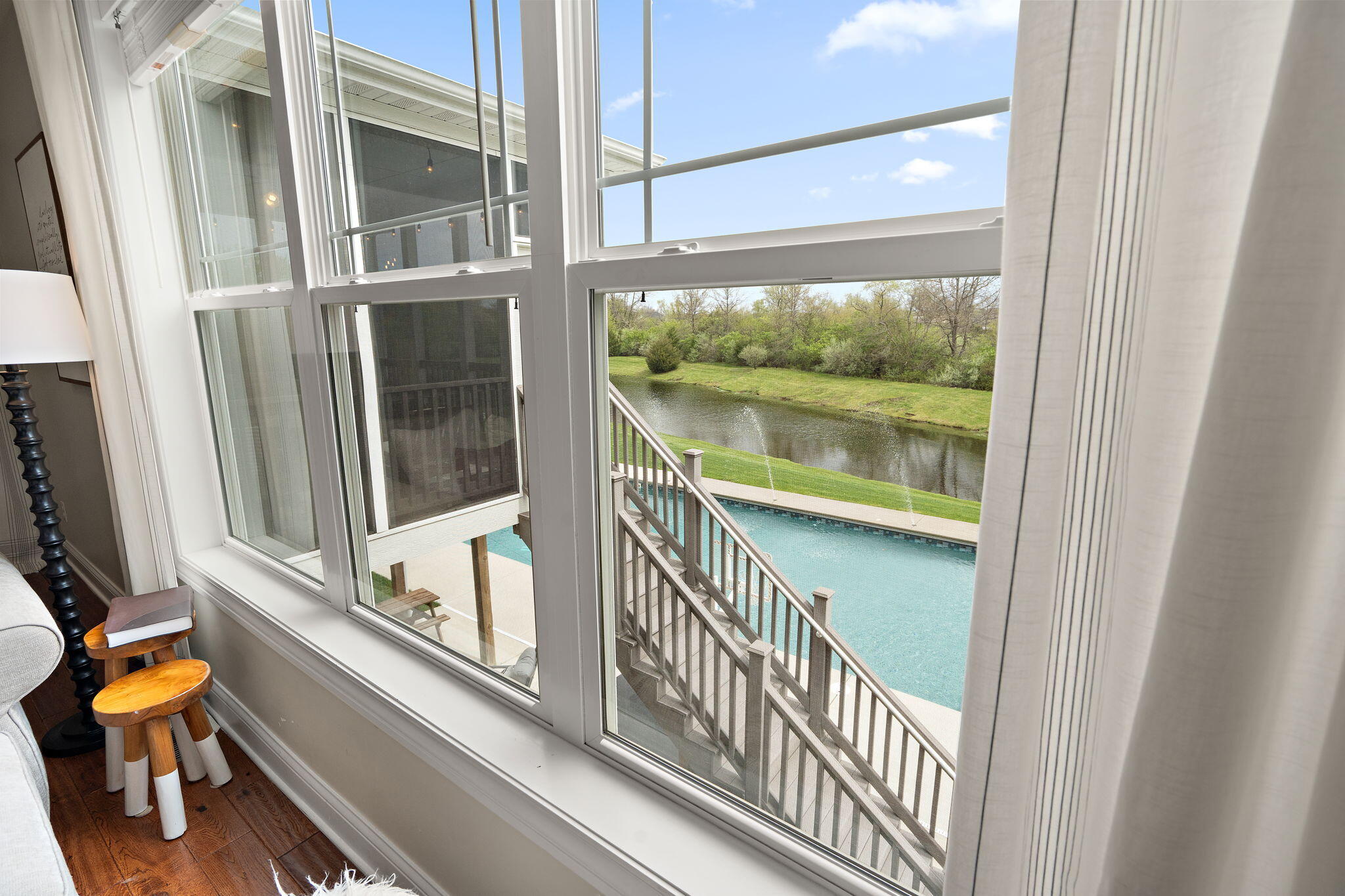 1684 Kleven Lane Crown Point, IN 46307 - Photo 21 of 55 a view of a balcony with chair and floor to ceiling window
