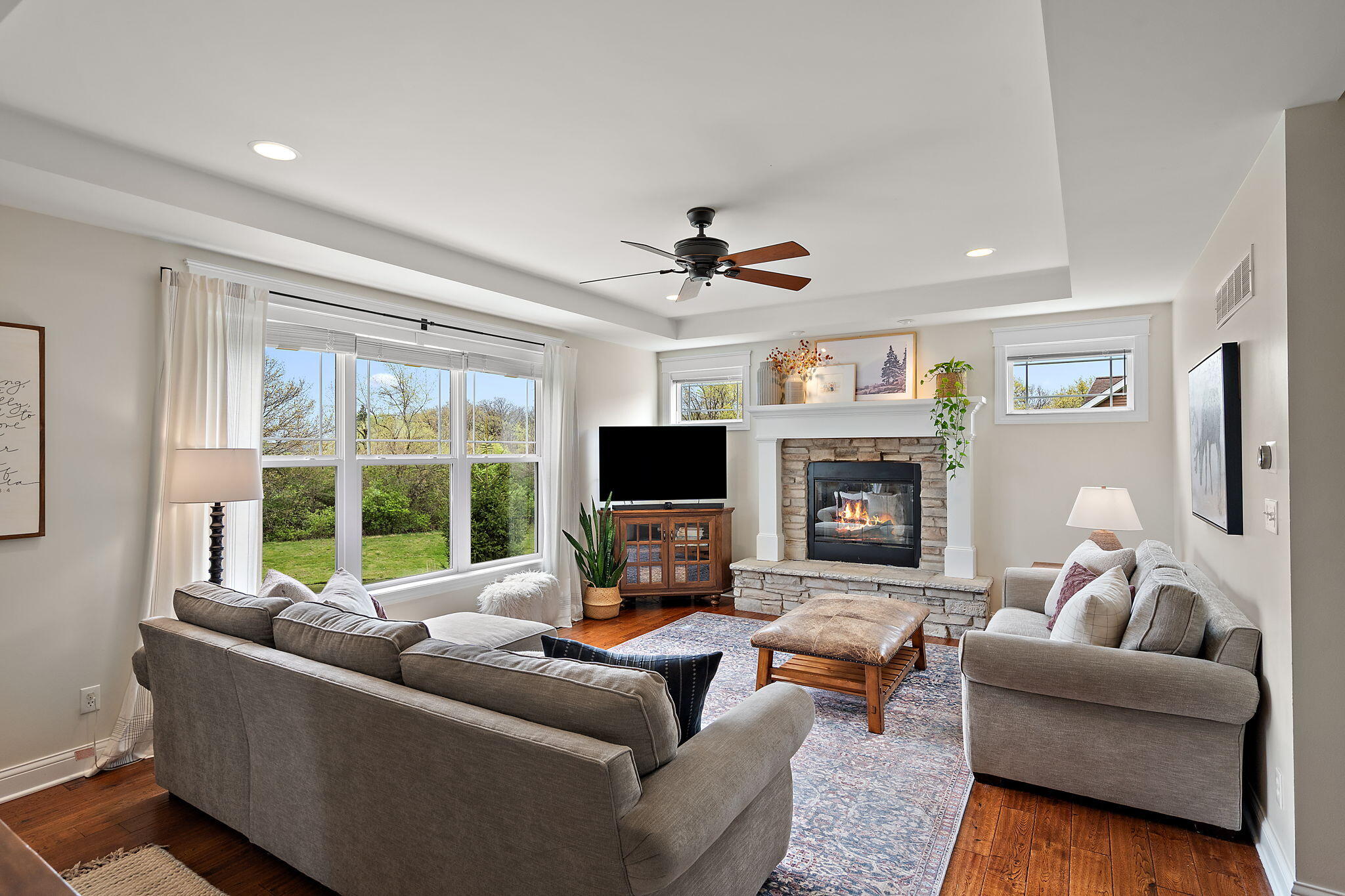 1684 Kleven Lane Crown Point, IN 46307 - Photo 6 of 55 a living room with furniture flat screen tv and a fireplace