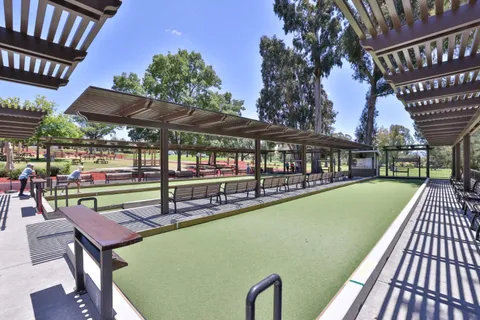 a view of a swimming pool with a patio