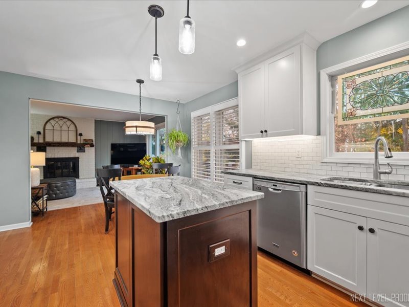 2040 Forest Ridge Road St. Charles, IL 60174 - Photo 11 of 33 a kitchen with granite countertop a sink a counter space appliances and cabinets