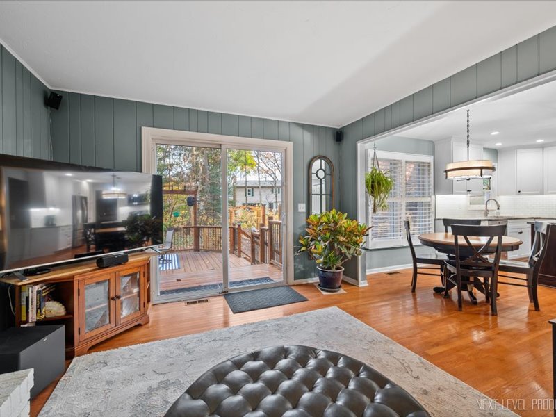 2040 Forest Ridge Road St. Charles, IL 60174 - Photo 14 of 33 a dining room with furniture and a floor to ceiling window