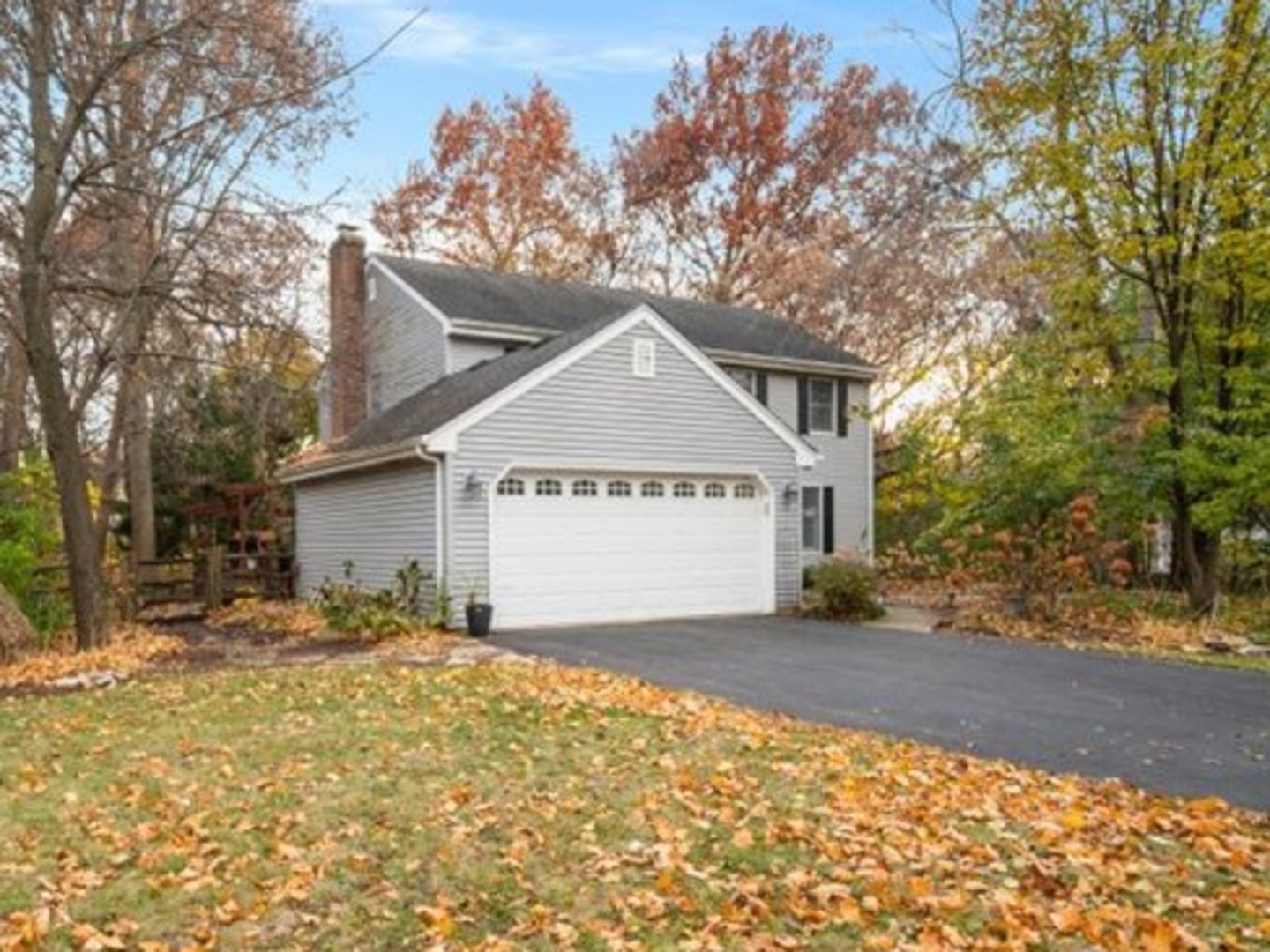 2040 Forest Ridge Road St. Charles, IL 60174 - Photo 2 of 33 a front view of a house with a yard
