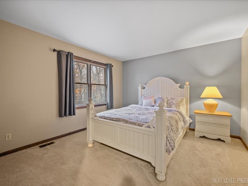 2040 Forest Ridge Road St. Charles, IL 60174 - Photo 22 of 33 a bedroom with a bed and window