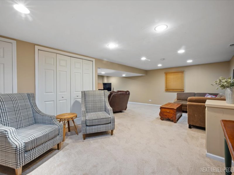 2040 Forest Ridge Road St. Charles, IL 60174 - Photo 26 of 33 a living room with furniture and a couch