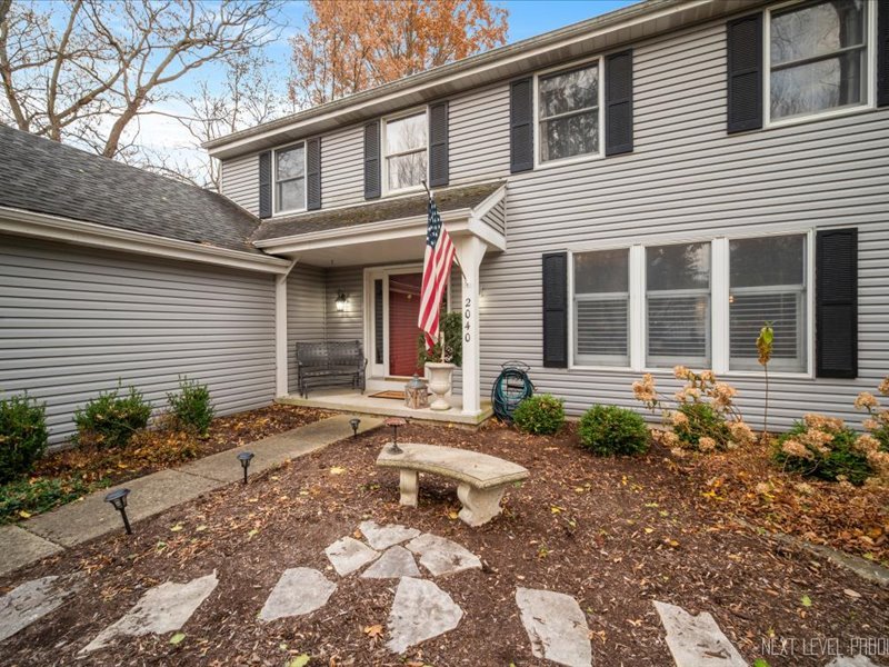 2040 Forest Ridge Road St. Charles, IL 60174 - Photo 3 of 33 a front view of a house with garden