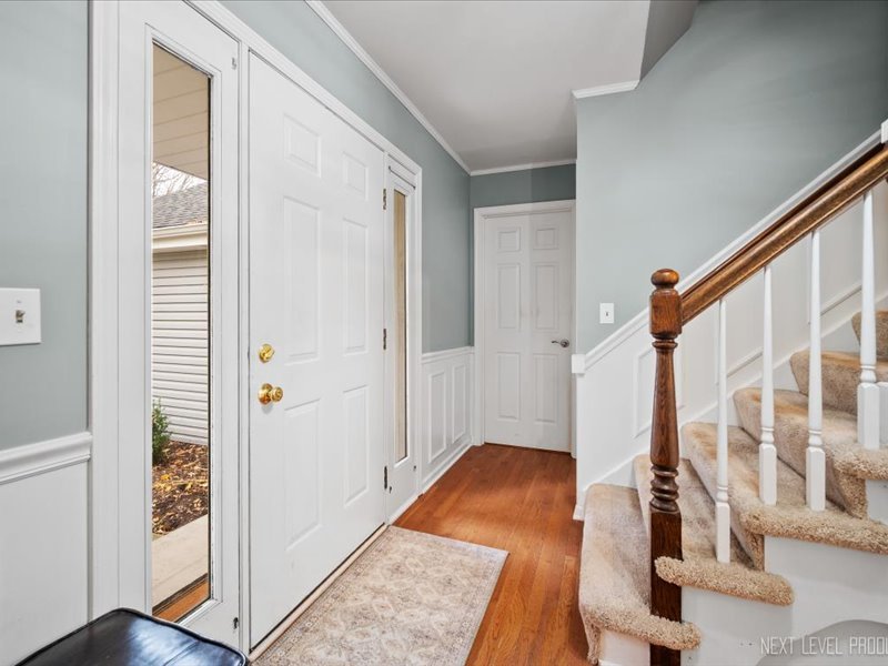 2040 Forest Ridge Road St. Charles, IL 60174 - Photo 4 of 33 hallway with wooden floor and furniture