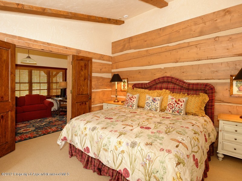 12 Arbaney Ranch Road, Unit 1/6 INTEREST Basalt, CO 81621 - Photo 3 of 22 a large bed sitting in a bedroom next to a window