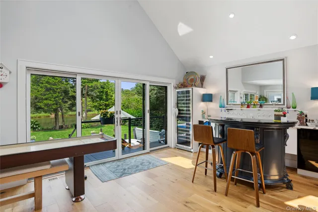 a kitchen with a stove and white cabinets