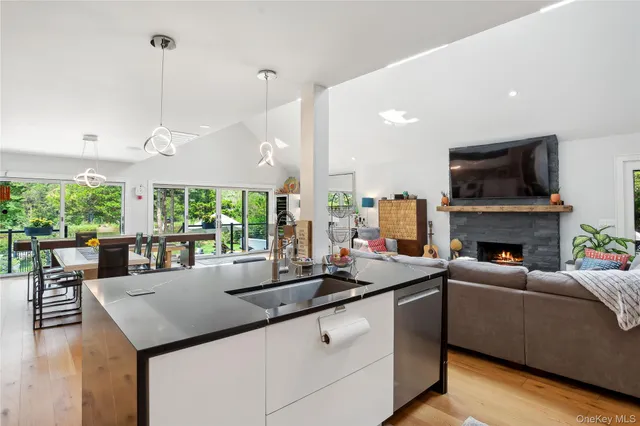 a kitchen with a stove and a wooden floor