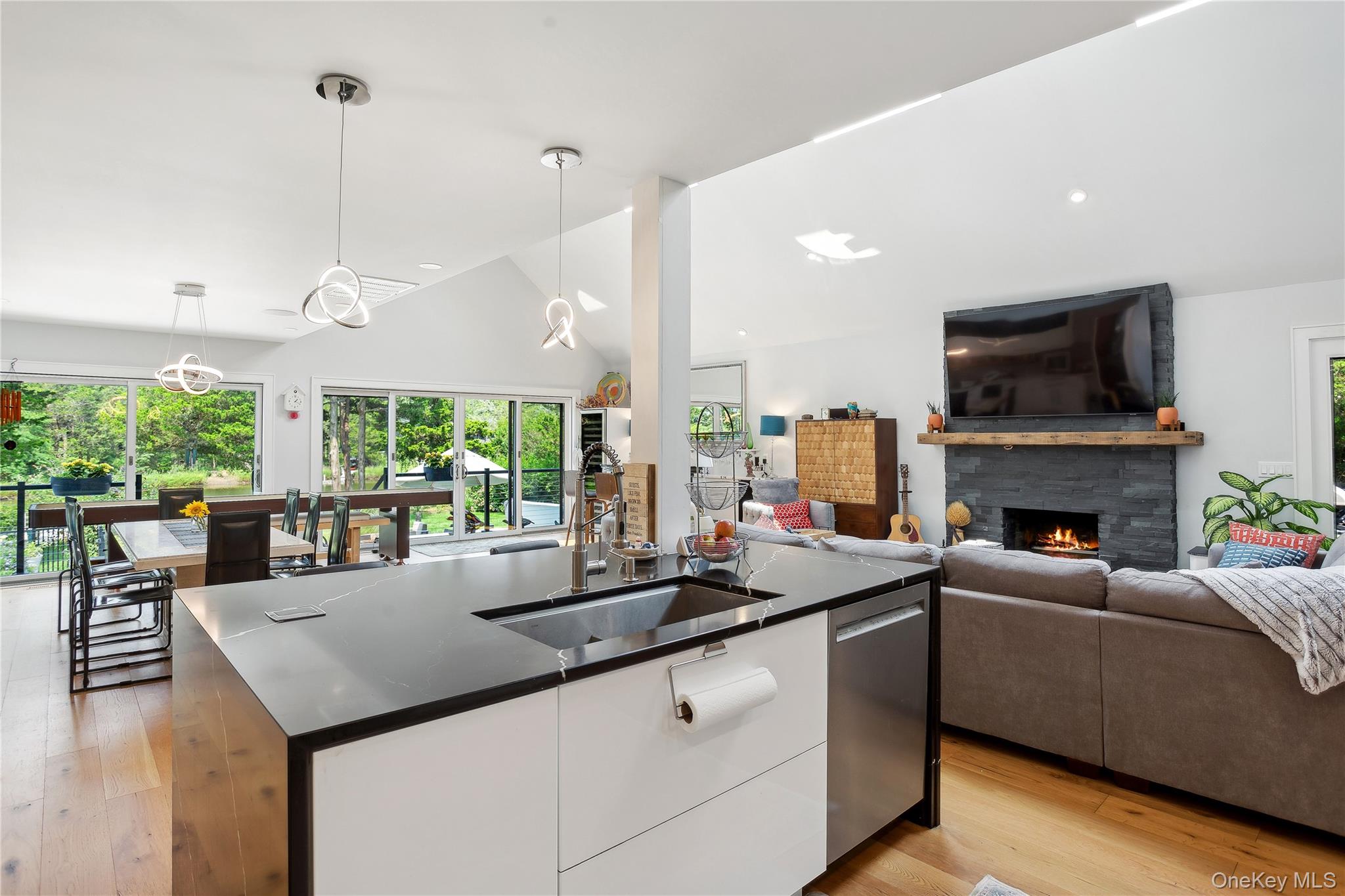 425 Cedar Point Drive East Southold, NY 11971 - Photo 13 of 47 a living room with fireplace furniture and a large window