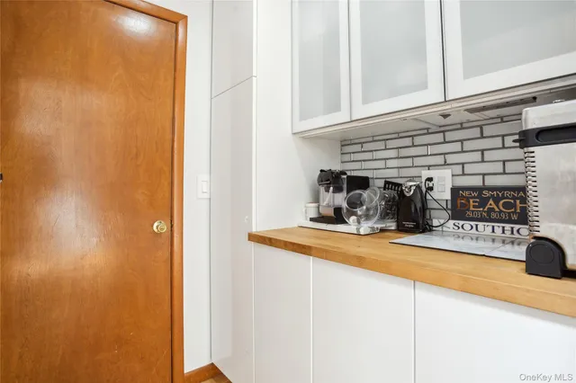 a living room with a large window and a couches