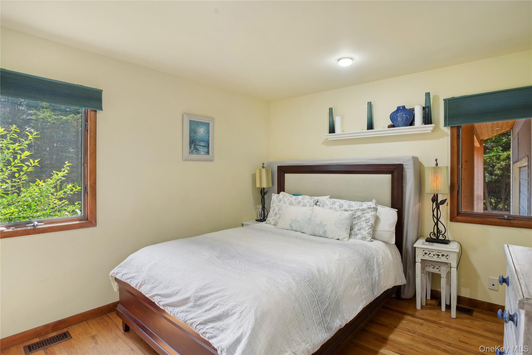 425 Cedar Point Drive East Southold, NY 11971 - Photo 24 of 47 a bedroom with a bed and a window