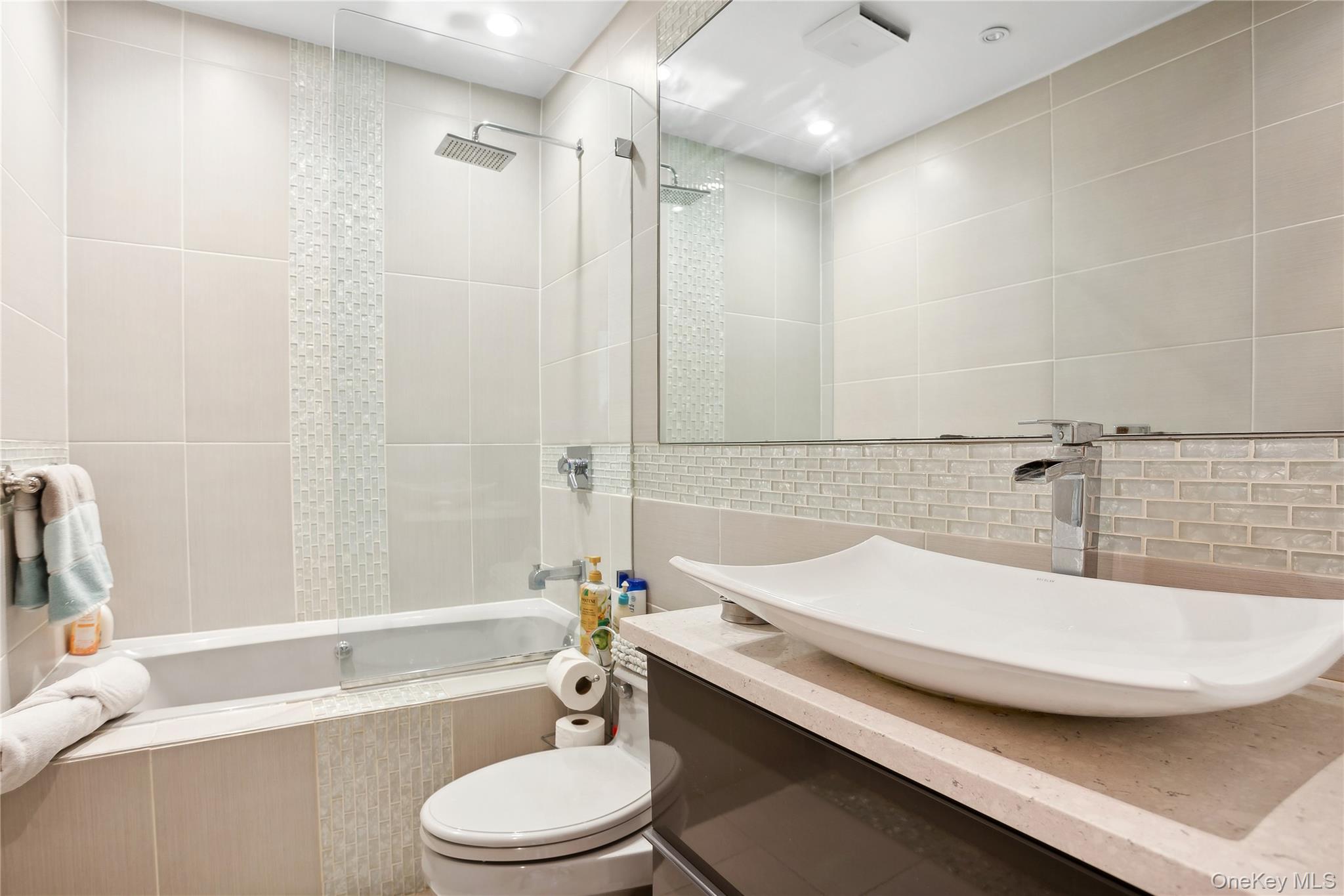 425 Cedar Point Drive East Southold, NY 11971 - Photo 25 of 47 a bathroom with a sink a toilet and bathtub