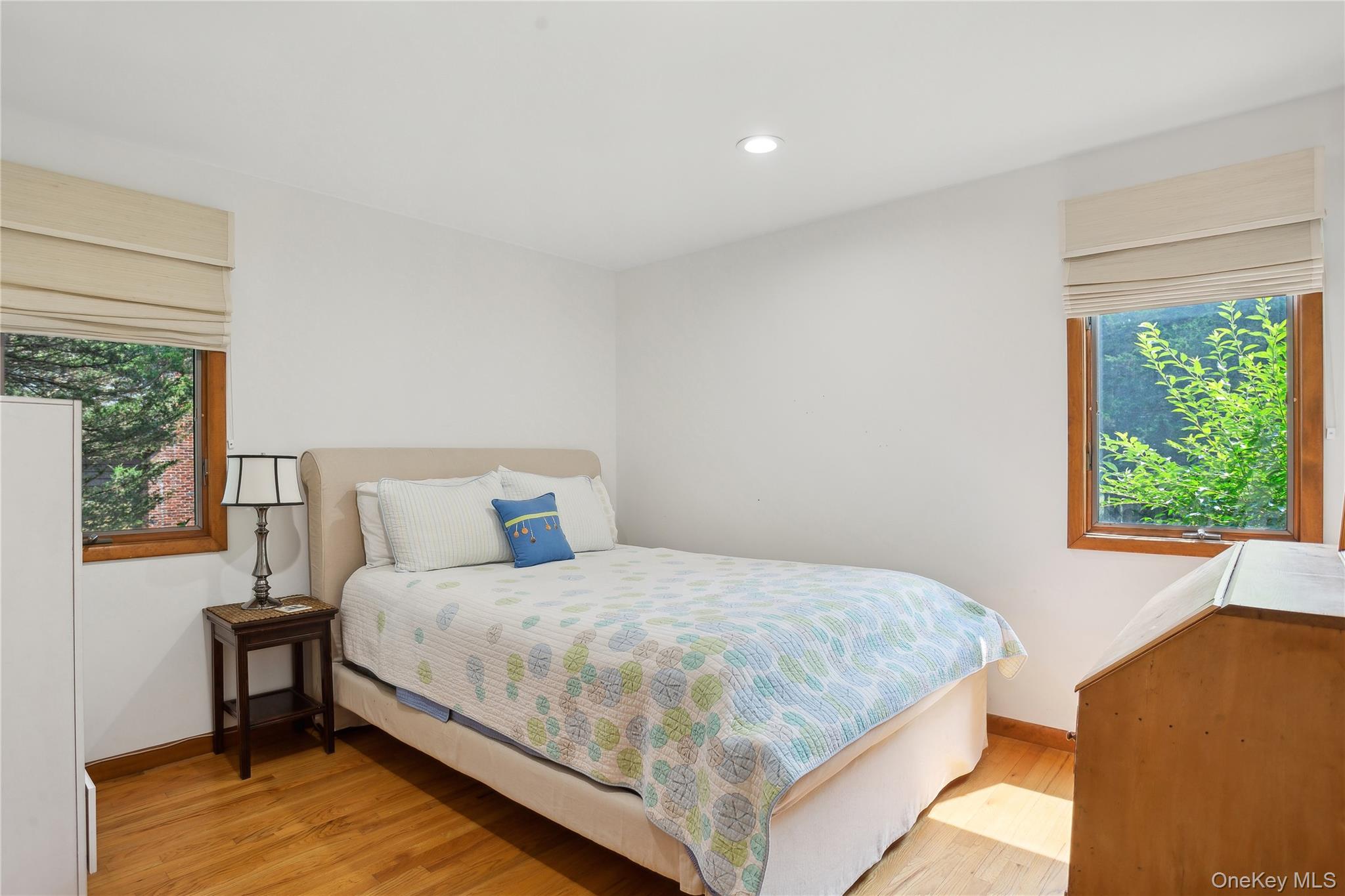 425 Cedar Point Drive East Southold, NY 11971 - Photo 26 of 47 a bedroom with a bed and a large window