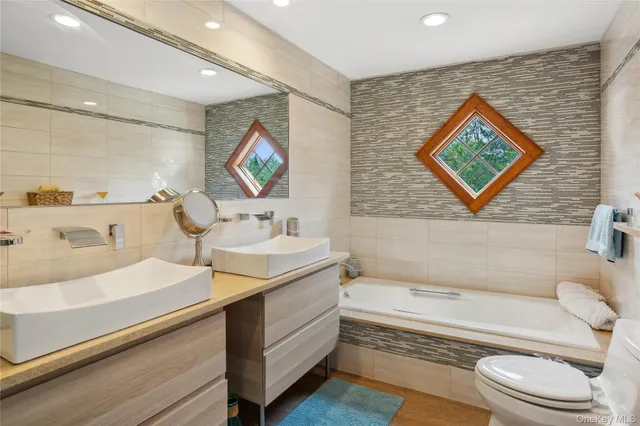 a view of a backyard with a patio and fire pit