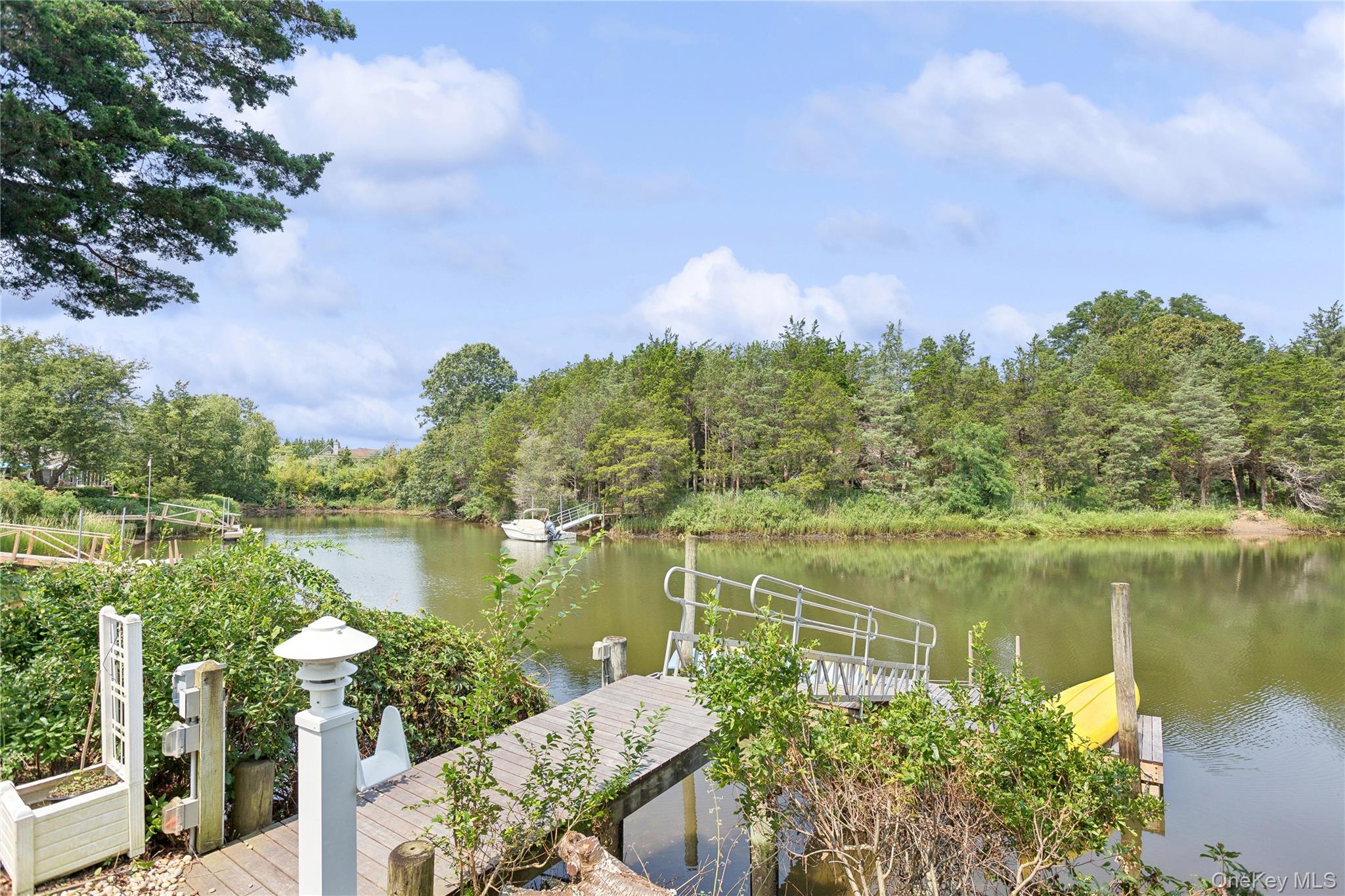 425 Cedar Point Drive East Southold, NY 11971 - Photo 33 of 47 a view of a lake with a garden