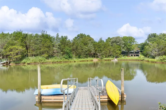 a view of a table and chairs under an umbrella