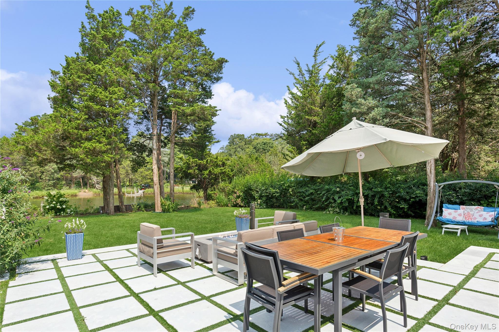 425 Cedar Point Drive East Southold, NY 11971 - Photo 35 of 47 a view of backyard with seating space and garden