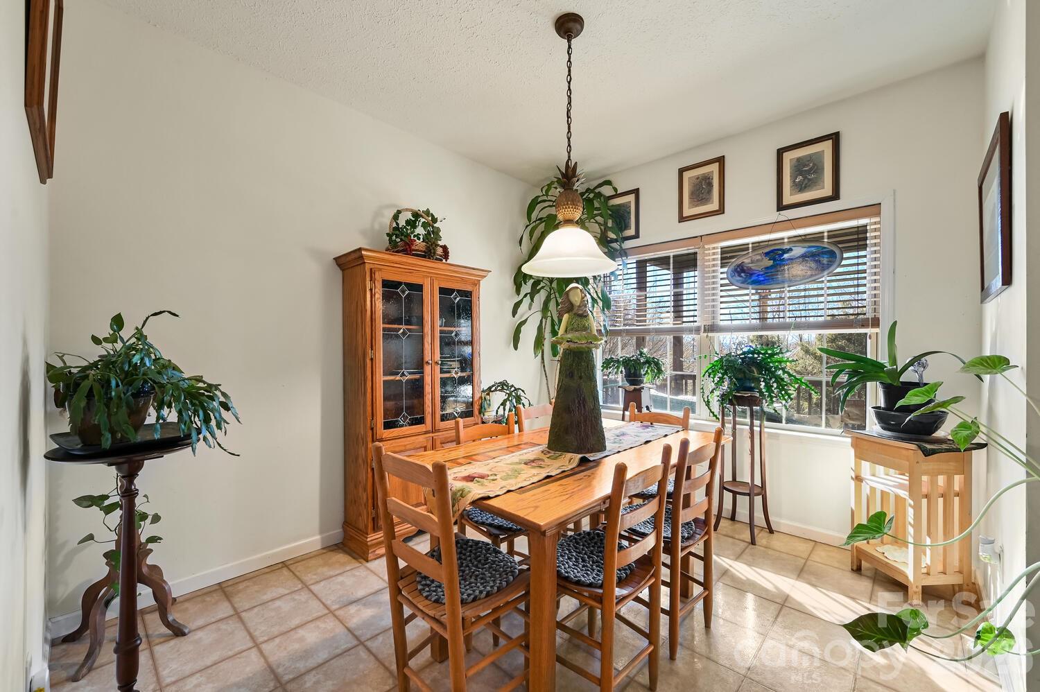 2 Ruffed Grouse Drive Weaverville, NC 28787 - Photo 12 of 44 a view of a dining room with furniture window and wooden floor