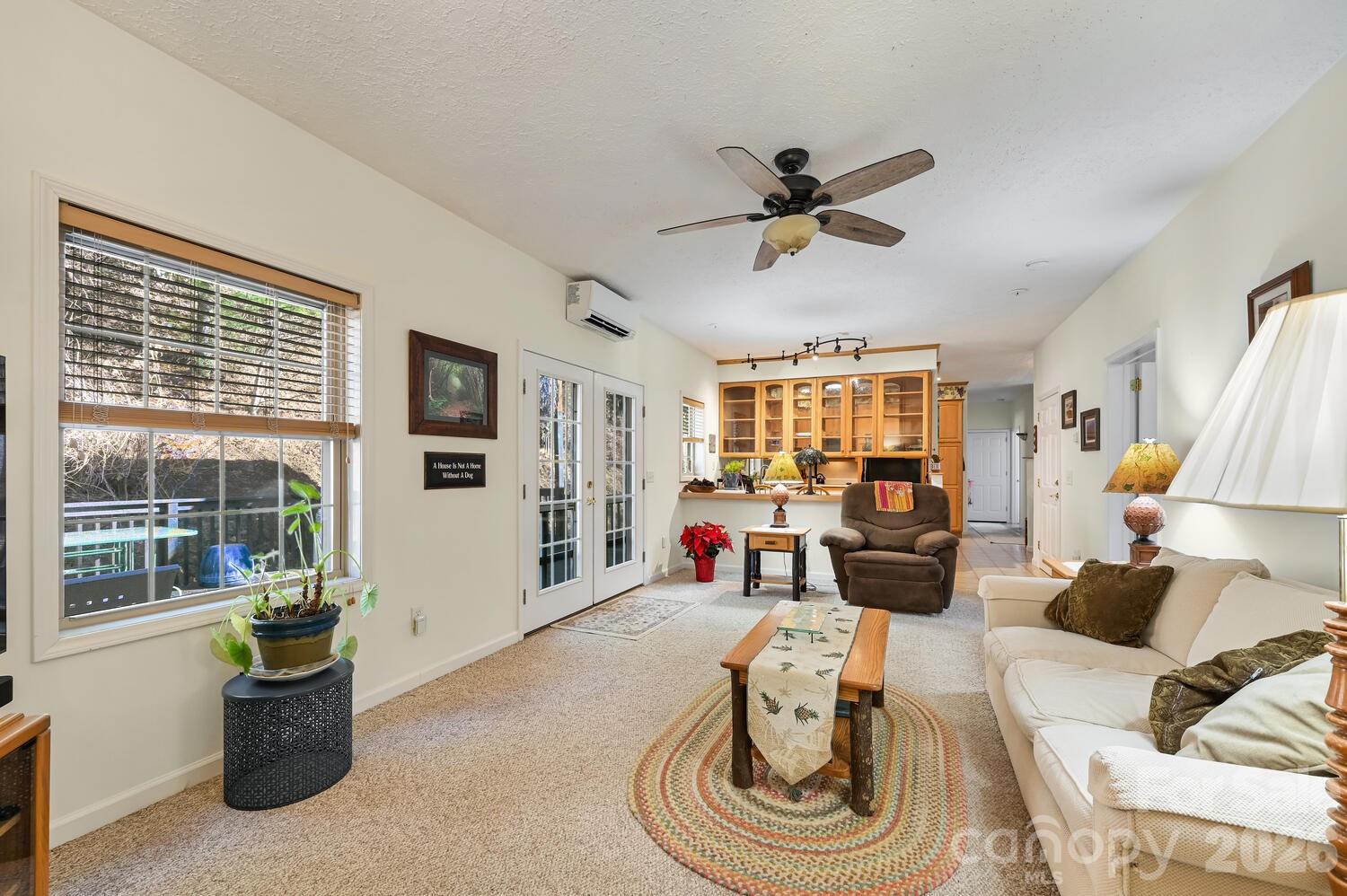 2 Ruffed Grouse Drive Weaverville, NC 28787 - Photo 14 of 44 a living room with furniture a flat screen tv and a large window