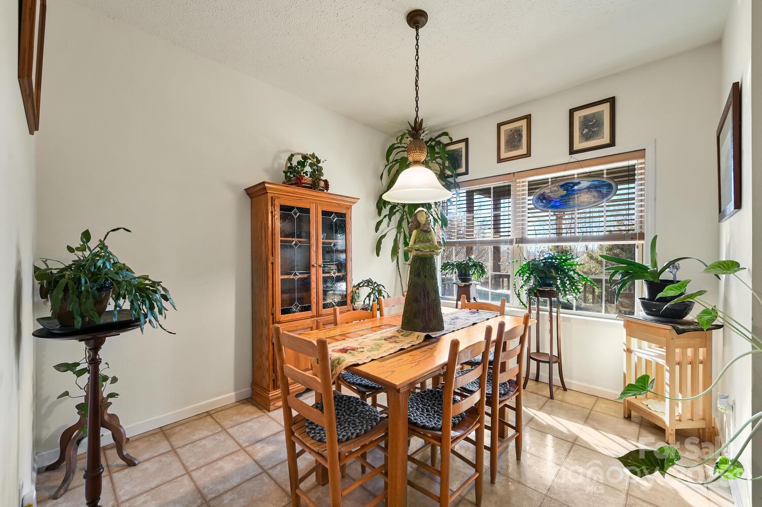 2 Ruffed Grouse Drive Weaverville, NC 28787 - Photo 14 of 44 a view of a dining room with furniture window and wooden floor