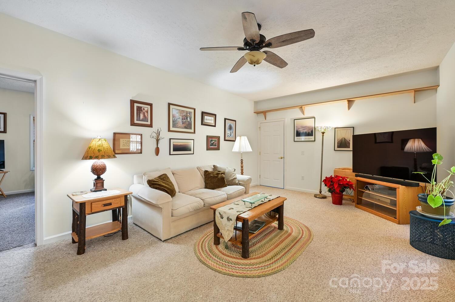 2 Ruffed Grouse Drive Weaverville, NC 28787 - Photo 15 of 44 a living room with furniture and a flat screen tv