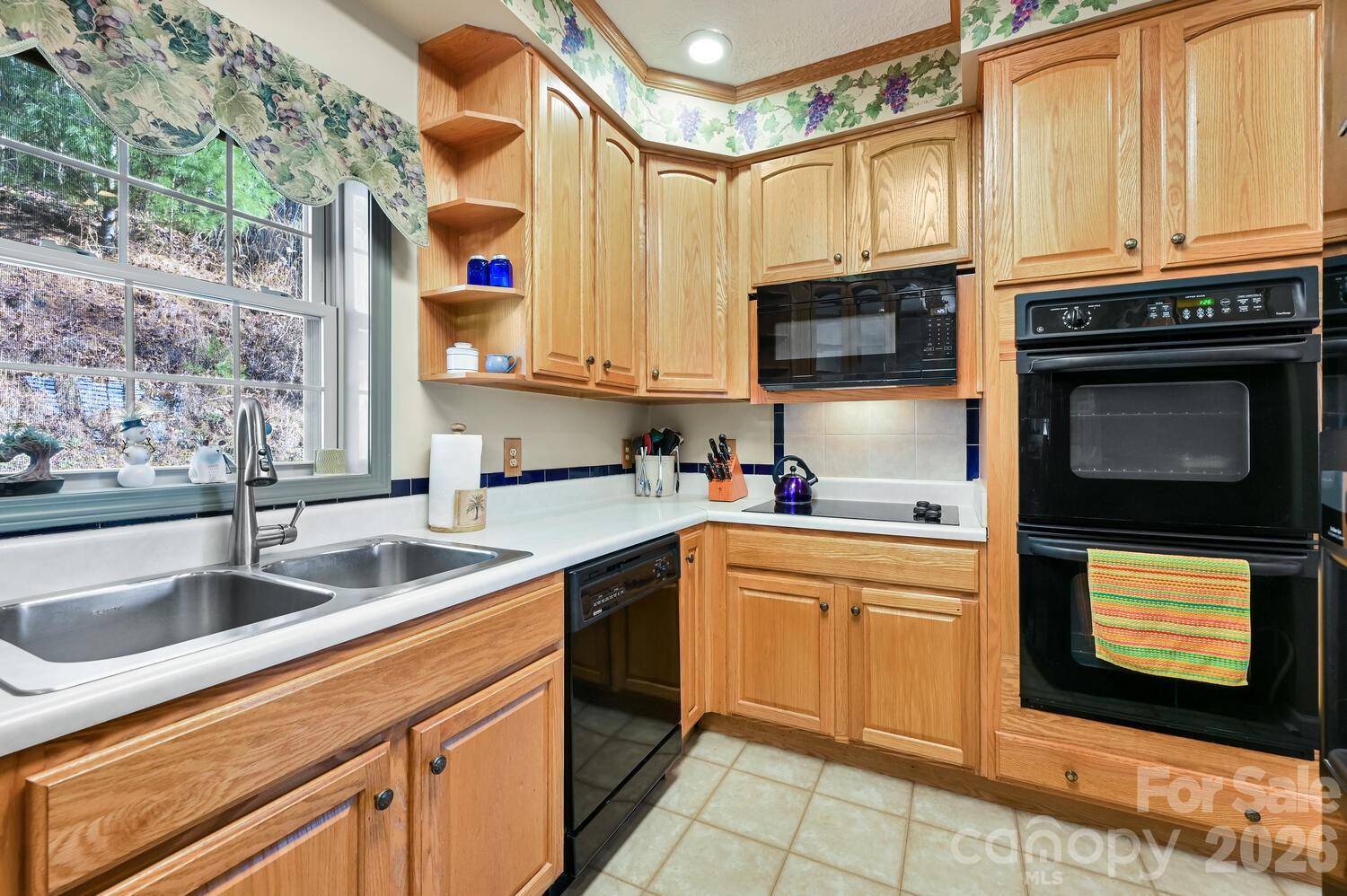 2 Ruffed Grouse Drive Weaverville, NC 28787 - Photo 17 of 44 a kitchen with stainless steel appliances granite countertop a sink and a stove