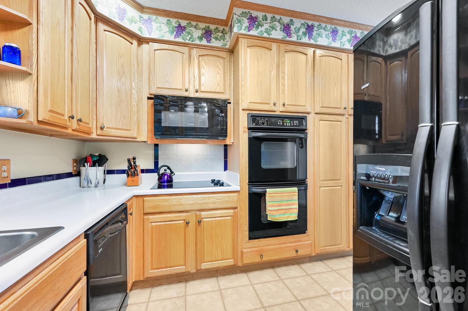 2 Ruffed Grouse Drive Weaverville, NC 28787 - Photo 19 of 44 a kitchen with stainless steel appliances a stove sink and cabinets