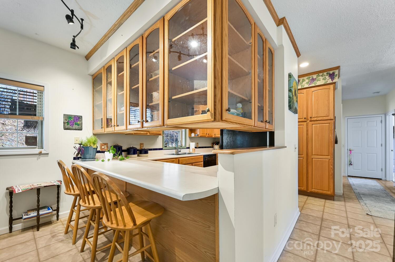 2 Ruffed Grouse Drive Weaverville, NC 28787 - Photo 20 of 44 a kitchen with a table chairs and a refrigerator