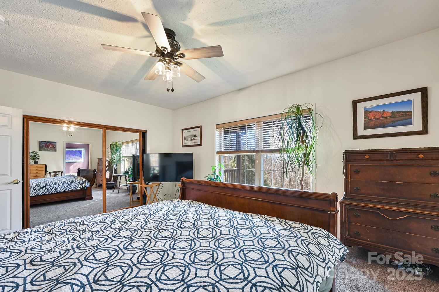 2 Ruffed Grouse Drive Weaverville, NC 28787 - Photo 25 of 44 a bedroom with a bed and wooden floor