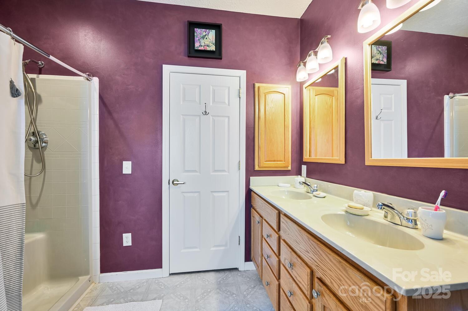 2 Ruffed Grouse Drive Weaverville, NC 28787 - Photo 28 of 44 a bathroom with a sink vanity and a mirror