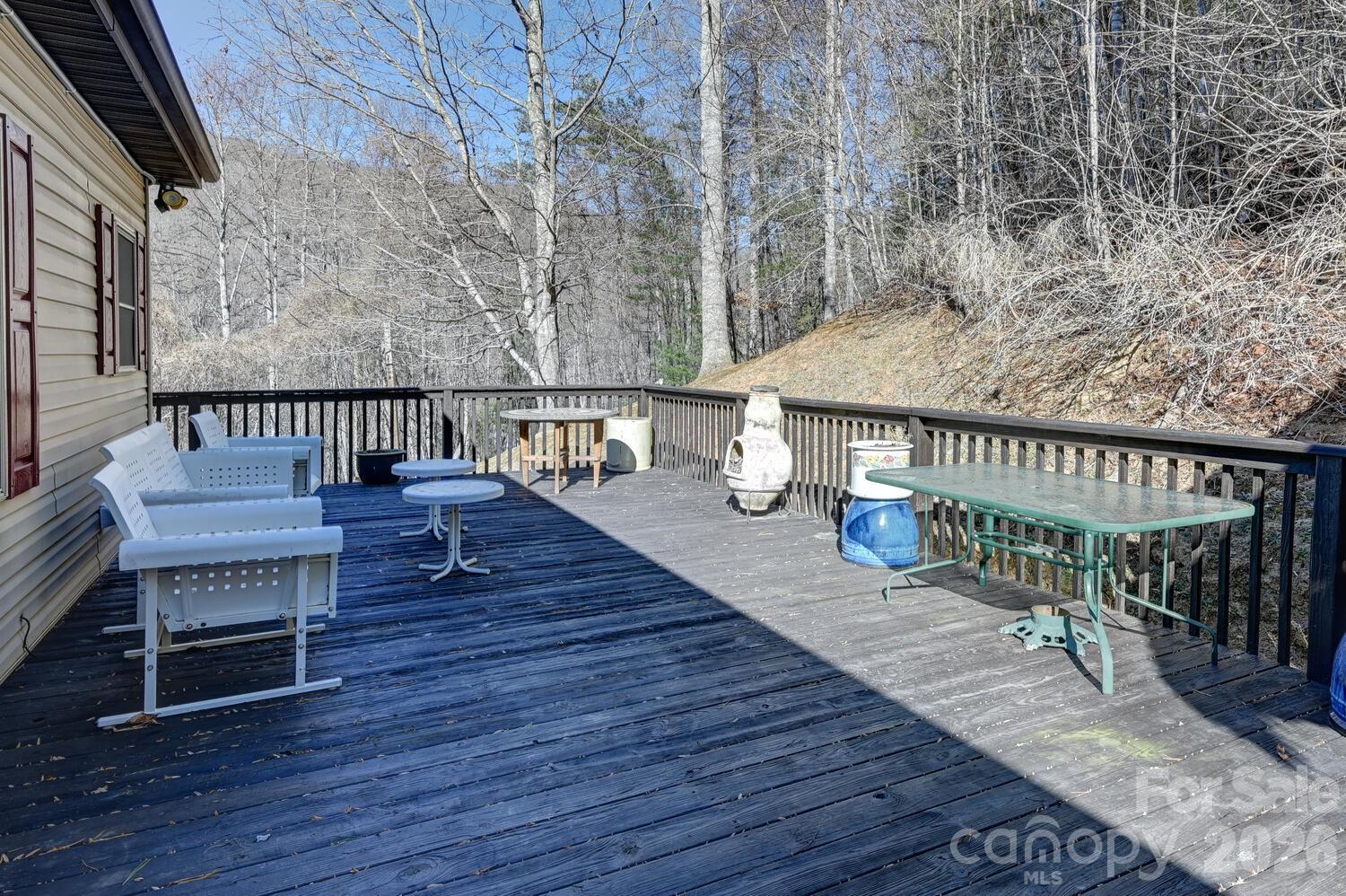 2 Ruffed Grouse Drive Weaverville, NC 28787 - Photo 32 of 44 a balcony with wooden floor table and chairs