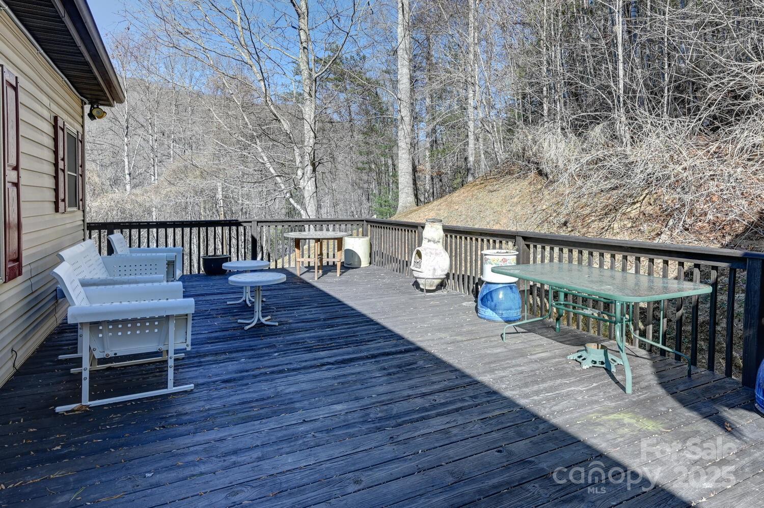 2 Ruffed Grouse Drive Weaverville, NC 28787 - Photo 34 of 44 a balcony with wooden floor table and chairs