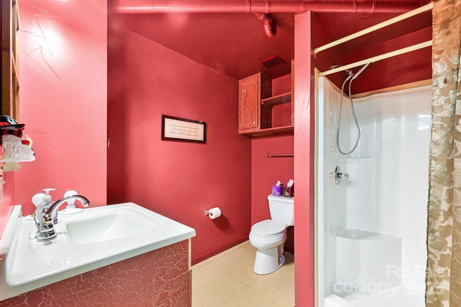 2 Ruffed Grouse Drive Weaverville, NC 28787 - Photo 36 of 44 a bathroom with a sink toilet and shower