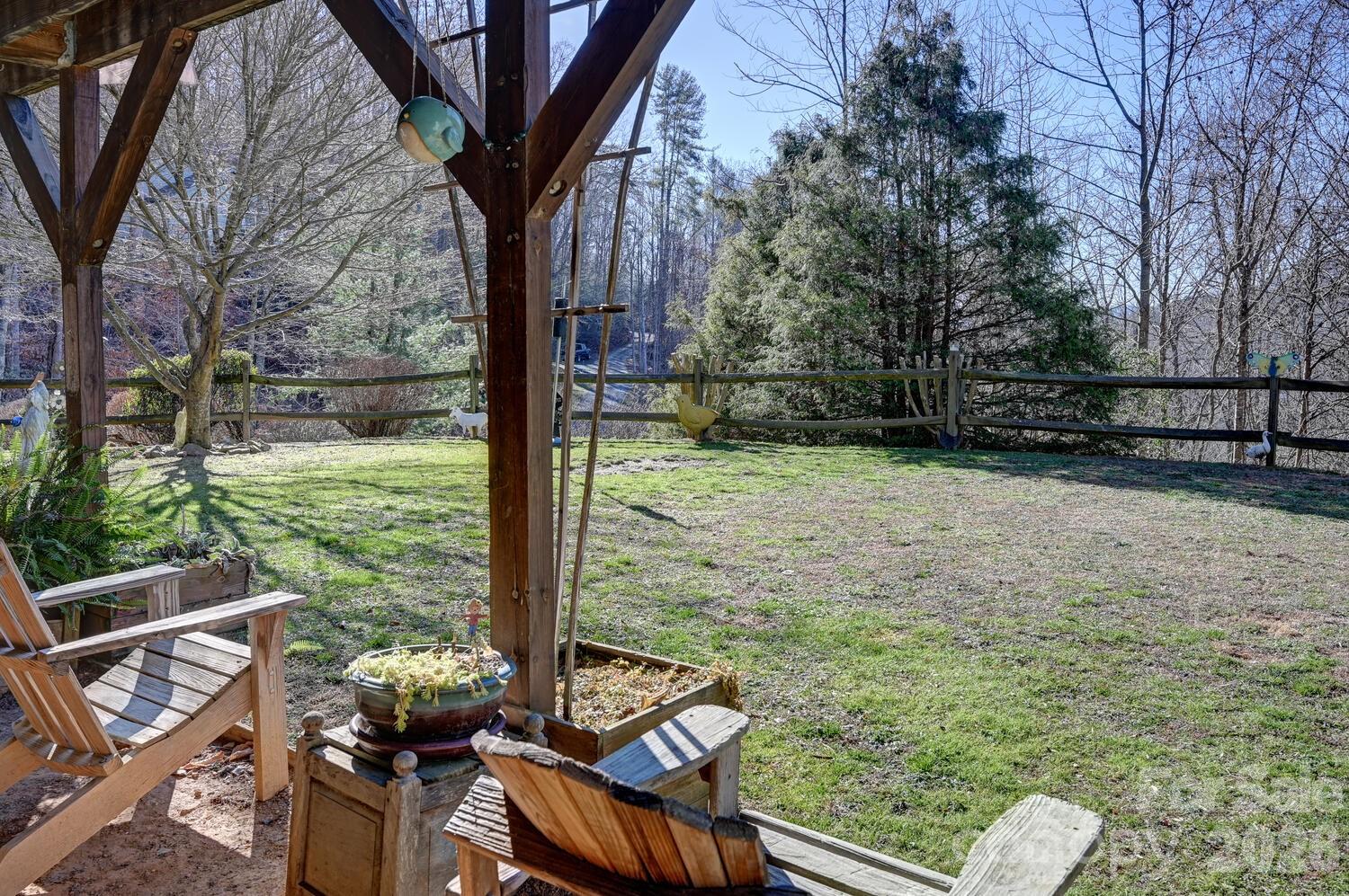 2 Ruffed Grouse Drive Weaverville, NC 28787 - Photo 5 of 44 a view of backyard with seating space and trees