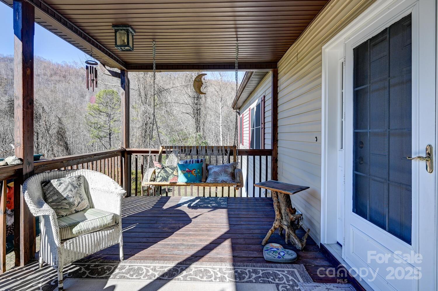 2 Ruffed Grouse Drive Weaverville, NC 28787 - Photo 8 of 44 a balcony with wooden floor and furniture