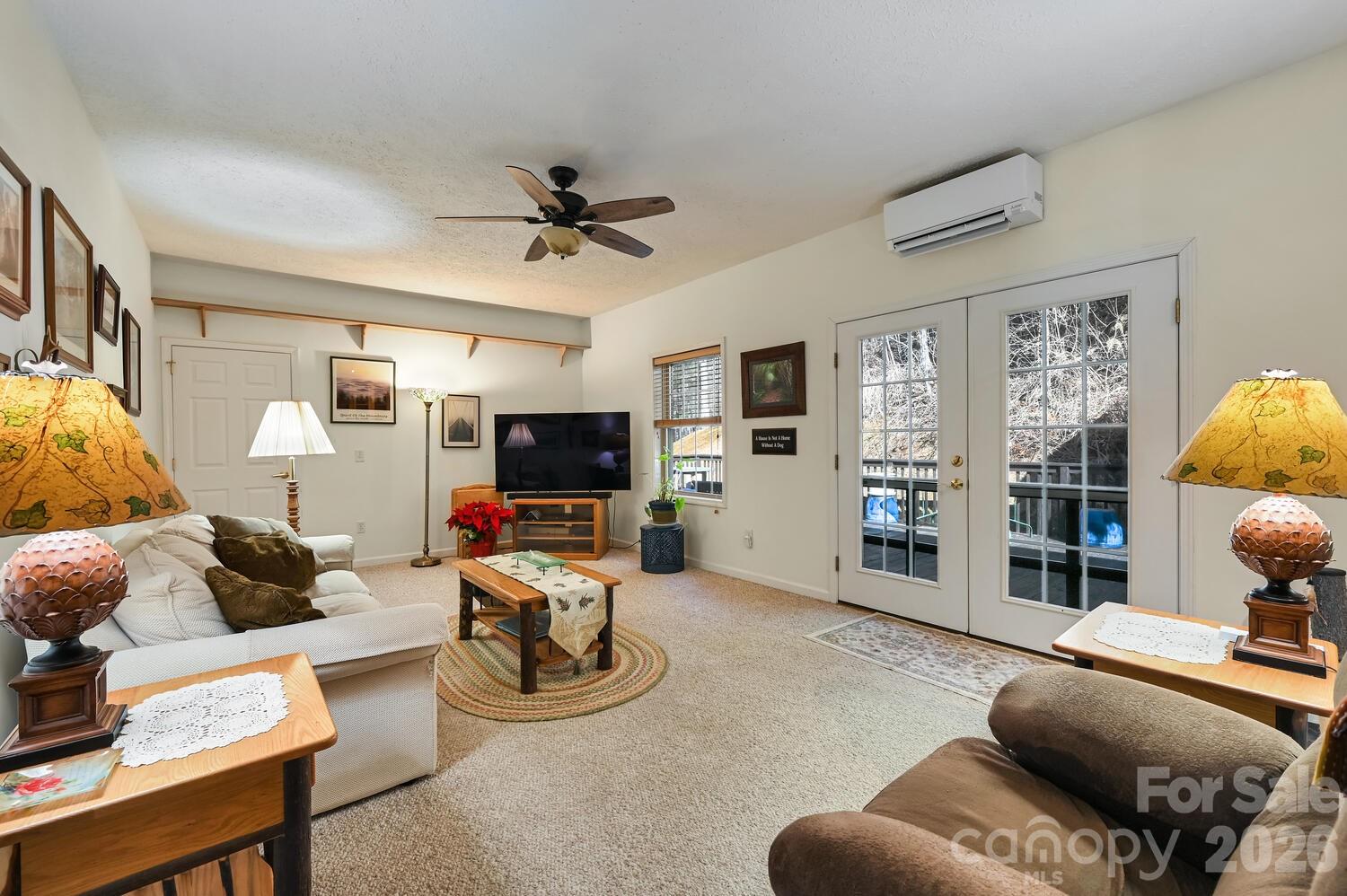 2 Ruffed Grouse Drive Weaverville, NC 28787 - Photo 10 of 44 a living room with furniture a flat screen tv and a large window