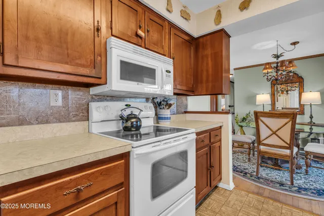 a kitchen with a sink and a microwave
