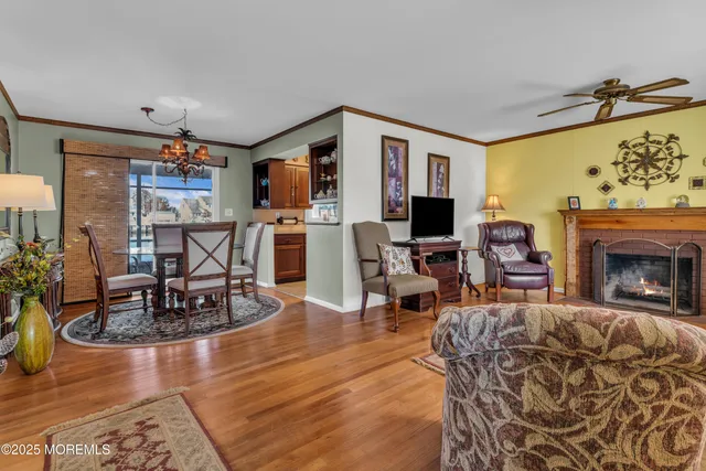 a workspace room with furniture and wooden floor